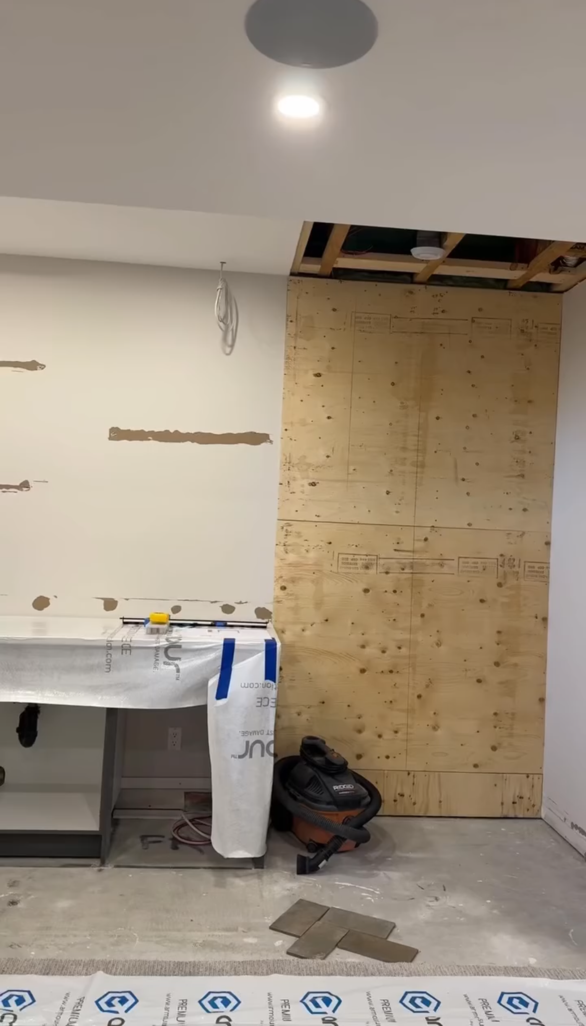 Unfinished interior wall with wood backing prepared for stone veneer installation